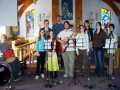 Andrew Smith (Drummer), Jacqueline Bennett, Meagan Warren, Phoebe & Wilfred Newhook, Michael Newhook, Shanna Smith, Michelle Higdon, robin Newhook, Lola Newhook Performing at The Good Shepherd Youth Service, Norman's Cove, April 30, 2006