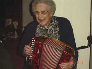 Mrs. Bessie Smith Playing her Accordion