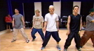 Does Justin know what it means to have one pant leg rolled up like that?