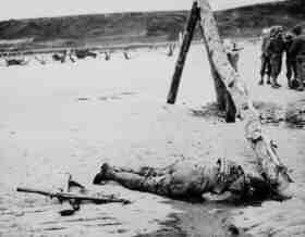a dead soldier on a beach in Normandy