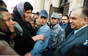 Ion Iliescu and his fan, older but golder...