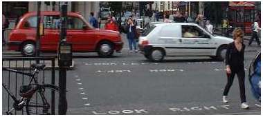street crossing with instructions to look right