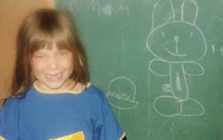 ..dressed as a cheerleader... drawing chalk bunnies...