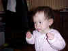 March 31, 2002: flossing her teeth with Easter grass