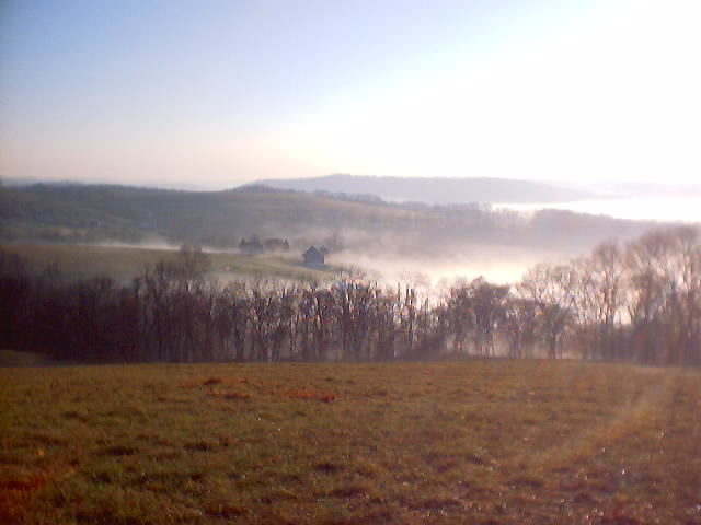 This photo was taken from the highest point on the farm. The larger building is the "big barn" with the house to the left of it.