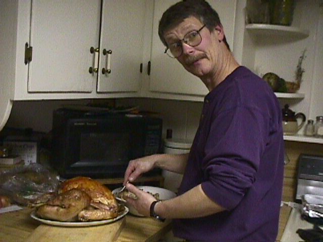 Chuck Carving Thankgiving Turkey 2002