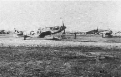 55th.FS P-51s warming up before take off.