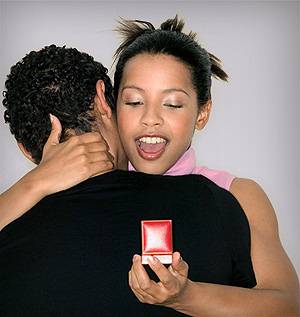 woman man engaged engagement ring red box latina latin black curly hair handsome gentleman couple married single boyfriend girlfriend