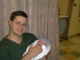 Jamie holds Marshall in the recovery room