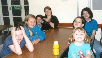 Groups of girls sitting around a table