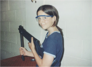 Stef loading her rifle