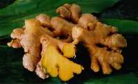 Ginger cut to reveal the golden yellow flesh