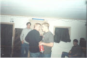 Jason requests a sip of soda while Swope overlooks and Jeremy plays with his bottle.