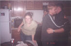 Megan poses, while Alex kisses Jason on the cheek.