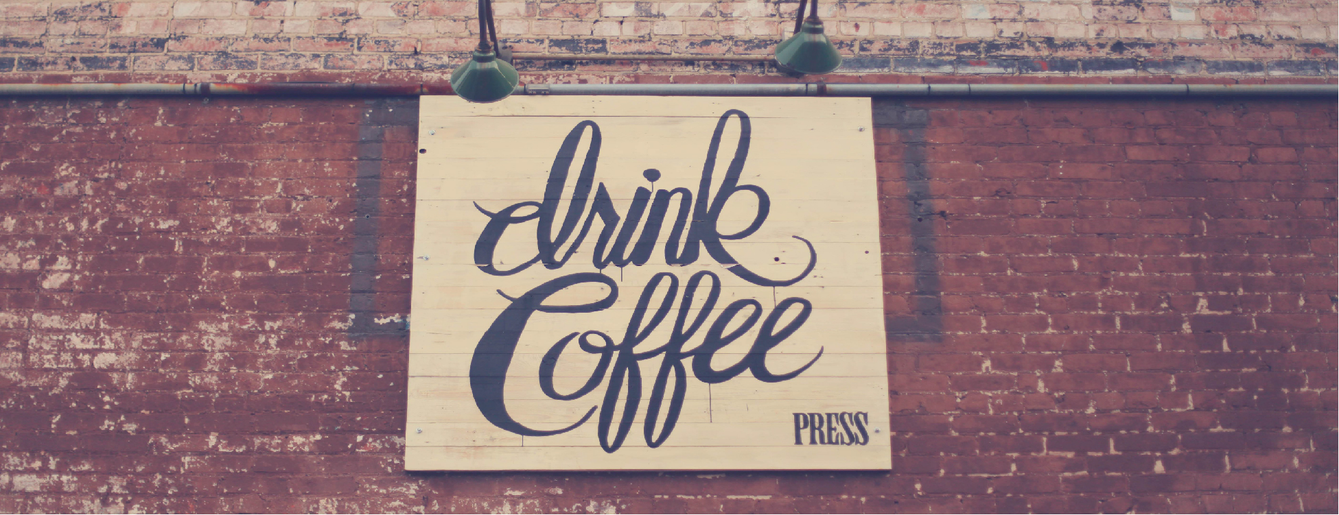 Sign that says 'Drink Coffee'