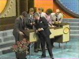 A contestant reaches for a lollipop