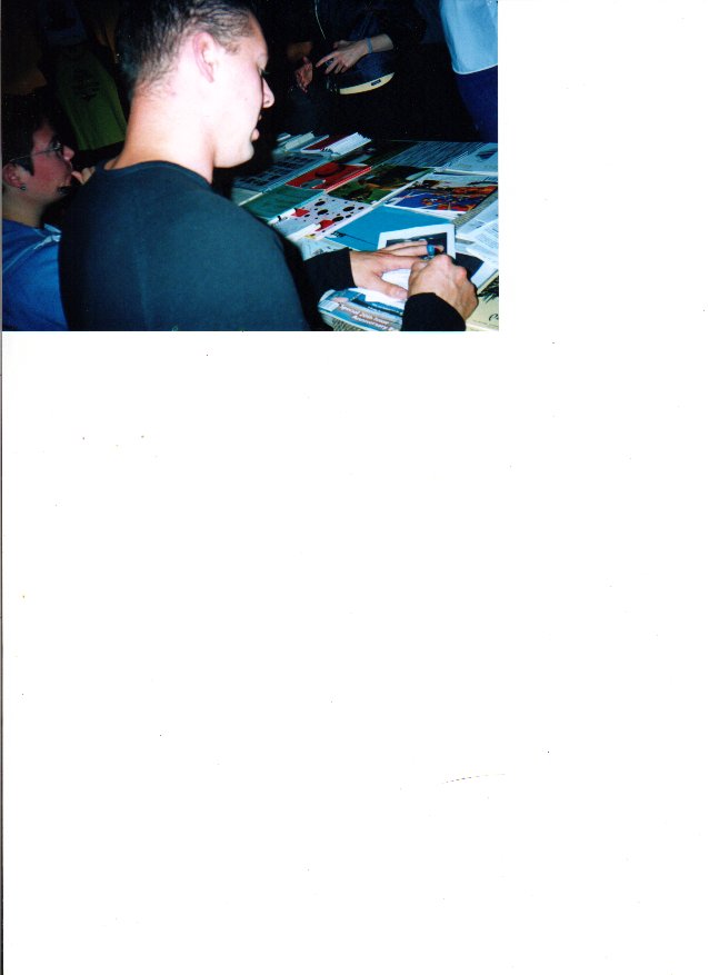 signing autographs