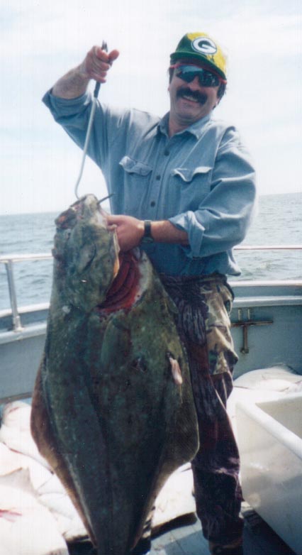 Mr. Champion-Of-The-Day shows off his catch
