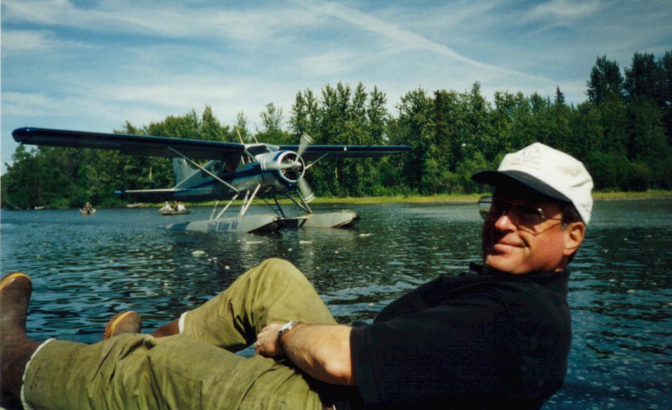 Bill (aka - Mr. Casual) poses as a frame for a passing floatplane.