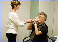 Occupational therapist working with patient