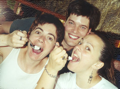 Christian and the girls stuff their faces with cheesecake.