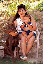 This is my human mom - Jessica - with her first dobie Lexus and Collin
