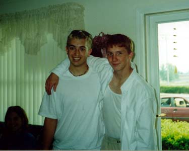 Daniel and me chillen at my house after graduation.