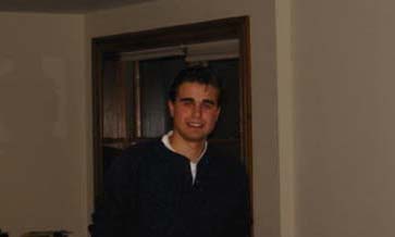 Tries to flash a smile for the camera after being caught off gaurd.