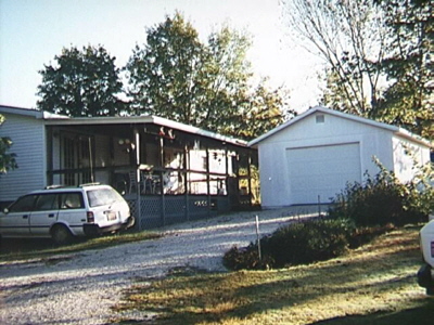 the back of their house where Paul built his garage