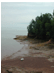 Another shore scene, this time with a tiny white row-boat, which gives perspective