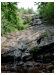 A veritcal panoramic shot of a trickling waterfall in the large Cape Breton National Park, around which the Cabot Trail winds