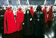 Emperor Palpatine and , along with several standing at attention aboard the second