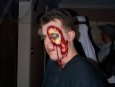 Bruce and the professionally made-up bloody gash on his face