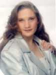 This is me with about 10 layers of makeup and a gallon of hairspray.  If you see me on the street I will probably NOT look like this... LOL  This was my senior pic.