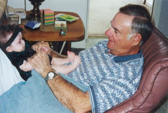 Thanksgiving 2000 - Grandpa Senger playing with Madison, 3 months old
