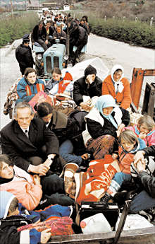 Line of Kosovo refugees waiting to be let into Albania