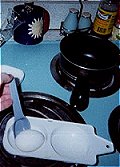 Speed the process by transferring egg to microwave cooker. Use plastique spoon for safety.