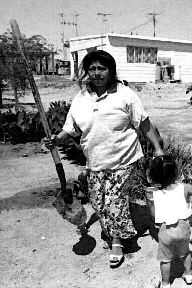 Guadalupe The Exploited JAF migrant laborer� and her child harvest missing letter E's for 7 pesos per E. She says, I'll find those missing E's. And when I do, I'll buy my child's freedom from Sinistra...