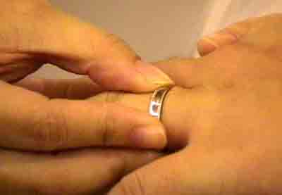 Joyce putting the ring onto my Shrek fingers.