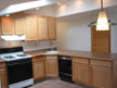 View of kitchen (and pantry door) from eat-in dining area