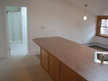 Bathroom entrance off kitchen