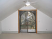 Cathedral ceiling living room with extra tall sliding glass door
