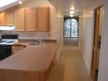 Long view of hallway leading to front of apartment