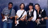 � Robert Knight. Backstage at Alpine Valley with Robert Cray, Eric Clapton and Jimmie Vaughan. Stevie died a few hours after this photo was taken, August 26, 1990.