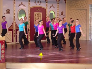 Laura is the girl in the middle with the pink shirt