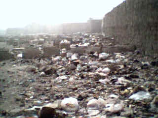 Years of garbage has collected inside the cemetery.