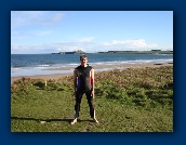 John tries Moira's wetsuit for size.