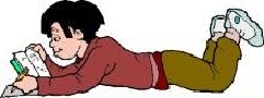 a boy laying on the floor reading
