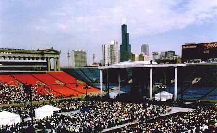 A picture in which men throng Soldier Field in Chicago (except for all the empty bleachers)