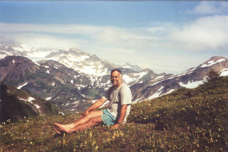 Jim resting in warm sun on Red Pass.